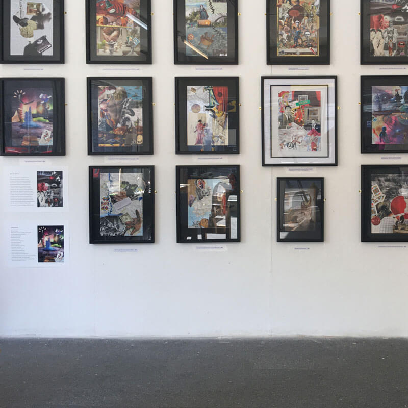A gallery wall with a series of framed collage images.