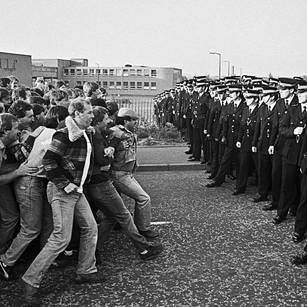 Image of police confronting striking miners in 1984.