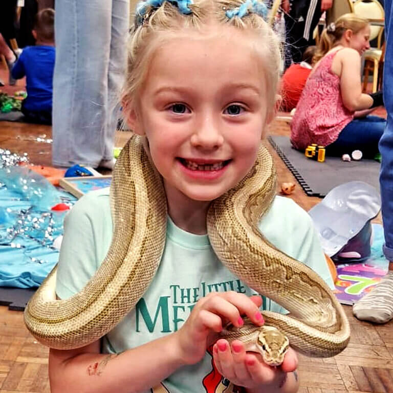 girl holding a snake.