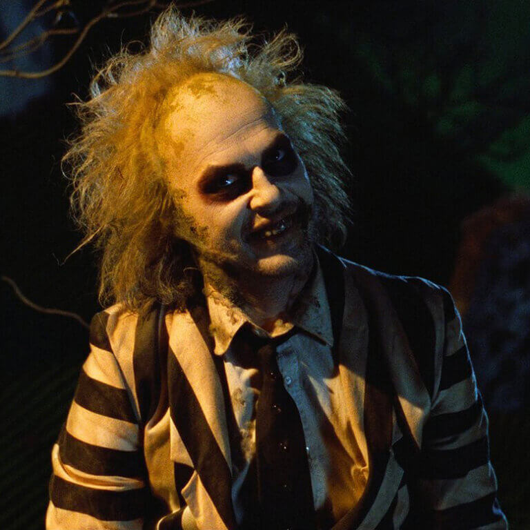 Still from the 1988 film Beetlejuice showing a close-up of Michael Keaton in the title role.