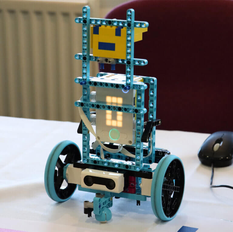 A small robot on a table.
